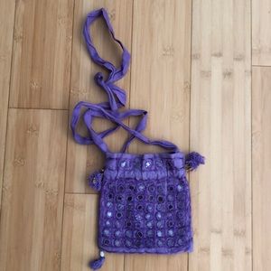 Crossbody bag perfect for travel evening.  Beautiful purple w/mirrored circles.
